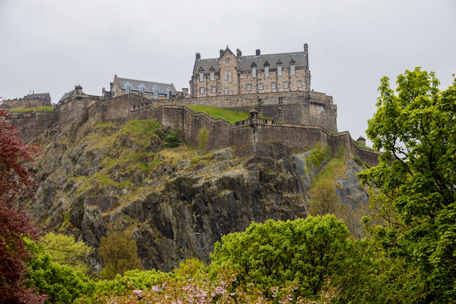 Edinburgh Castle on Castle Rock framed by spring greenery
