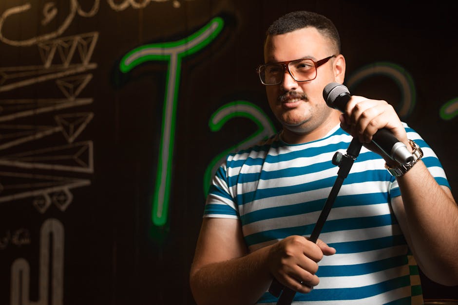 Stand-up comedian performing at Edinburgh comedy club at night