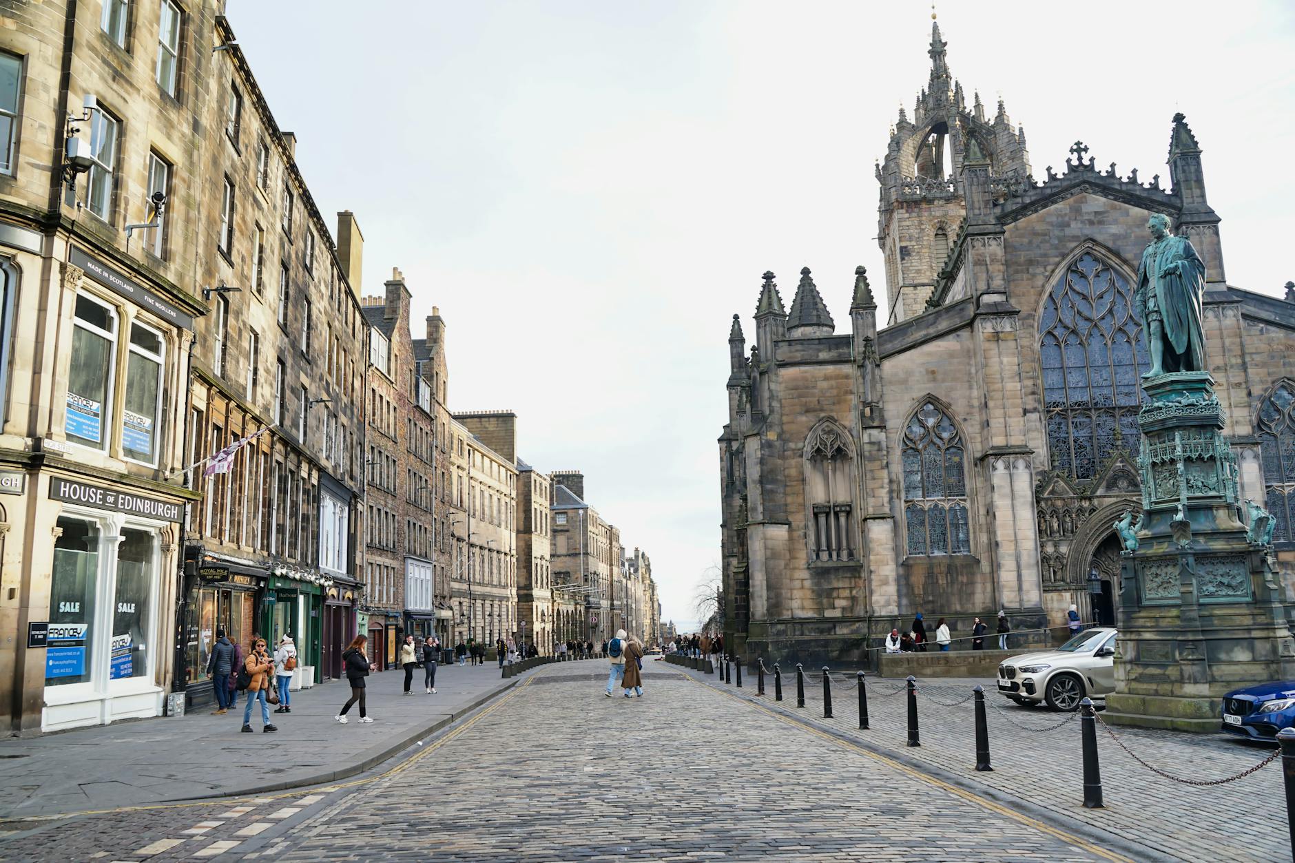 Guided walking tour group exploring Edinburgh streets, the best first activity for first time in Edinburgh