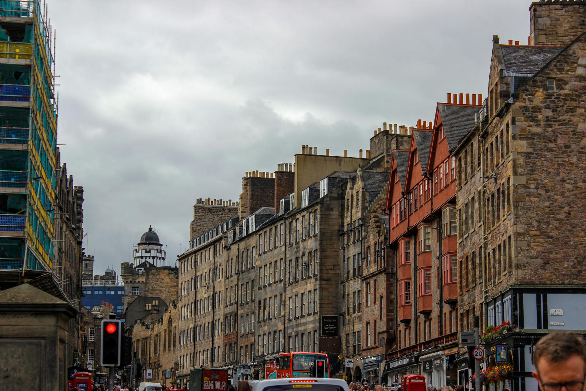 The Grassmarket in Edinburgh's Old Town — a lively historic square beneath Edinburgh Castle with independent shops and traditional pubs