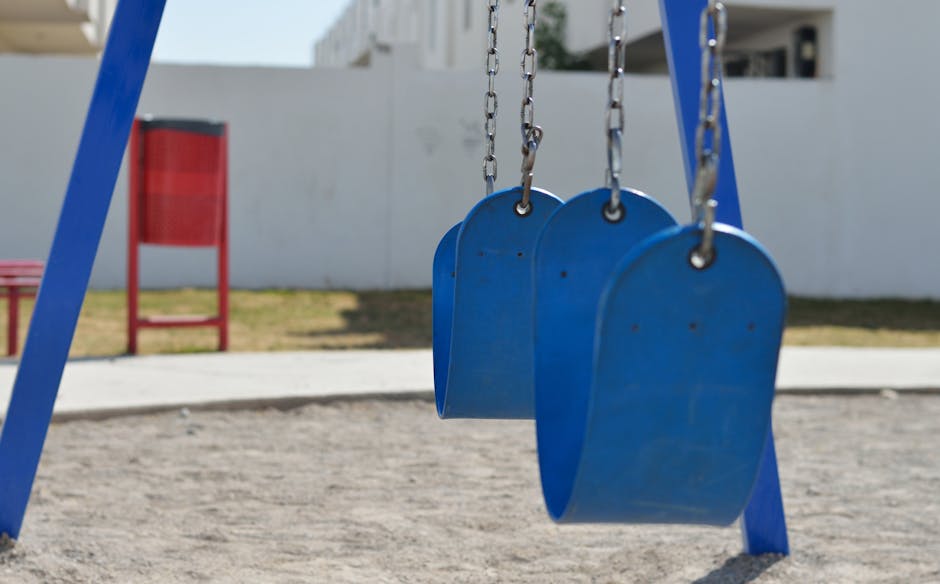 Toddler on swing at Edinburgh park playground