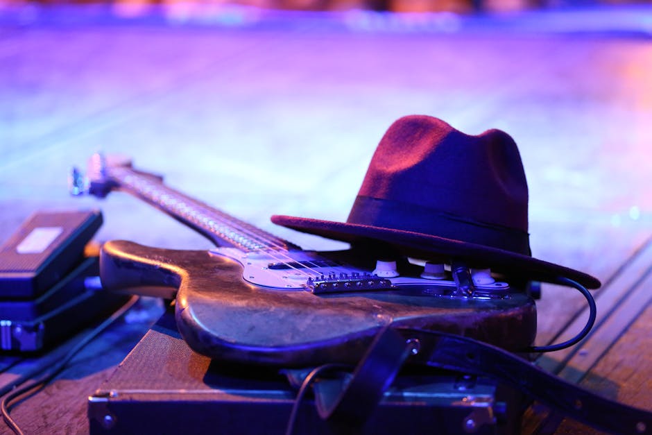 Guitarist performing on stage at a music event in Edinburgh