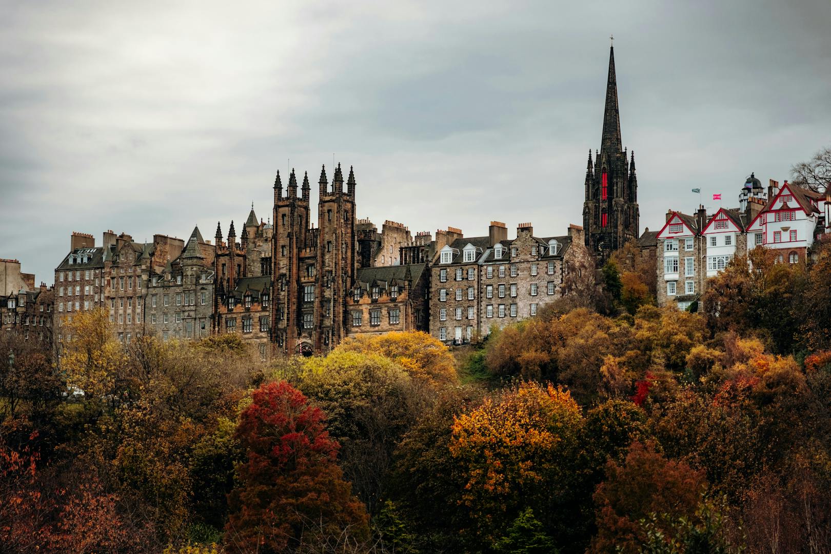 Edinburgh in autumn with golden leaves and stone architecture
