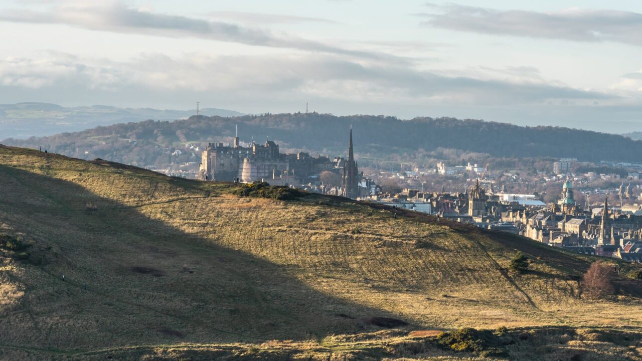View over Edinburgh towards Edinburgh Castle from the slopes of Holyrood Park