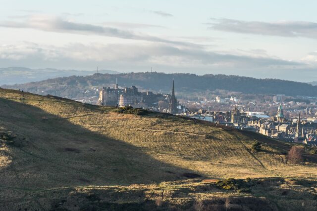 View over Edinburgh towards Edinburgh Castle from the slopes of Holyrood Park