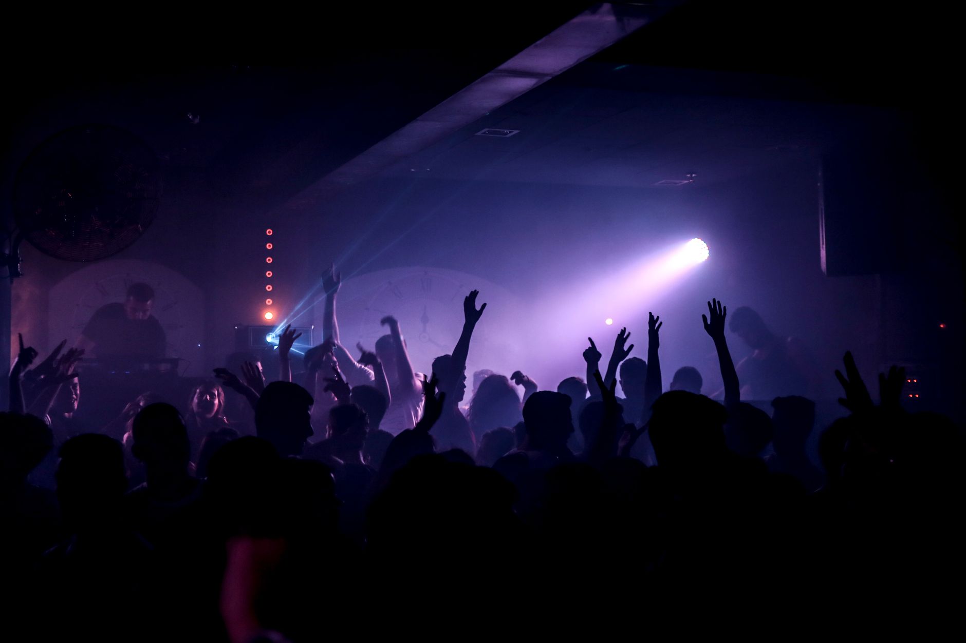 Crowd dancing under coloured lights in an Edinburgh nightclub