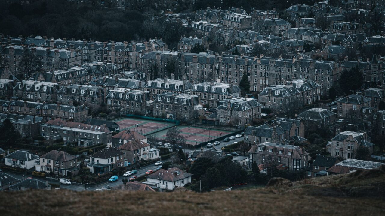 Rows of Edinburgh stone tenements and villas in the southern suburbs seen from a hilltop
