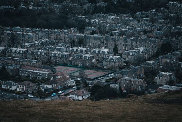 Rows of Edinburgh stone tenements and villas in the southern suburbs seen from a hilltop