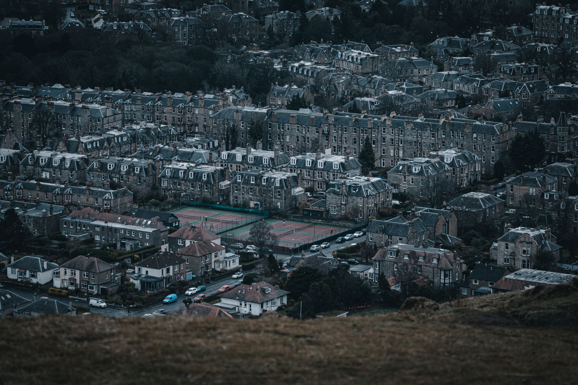 Rows of Edinburgh stone tenements and villas in the southern suburbs seen from a hilltop