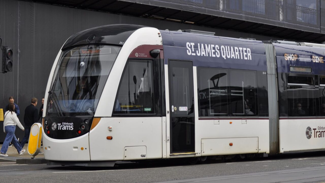 An Edinburgh tram in St James Quarter advertising livery