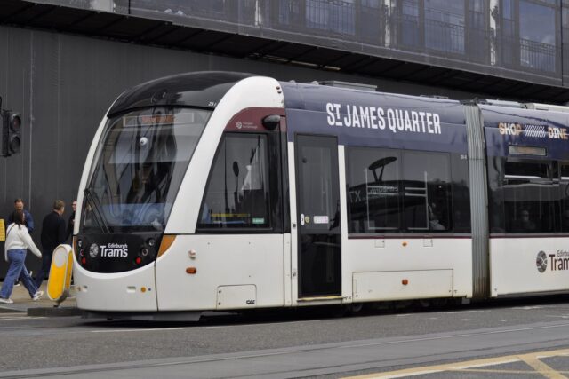 An Edinburgh tram in St James Quarter advertising livery