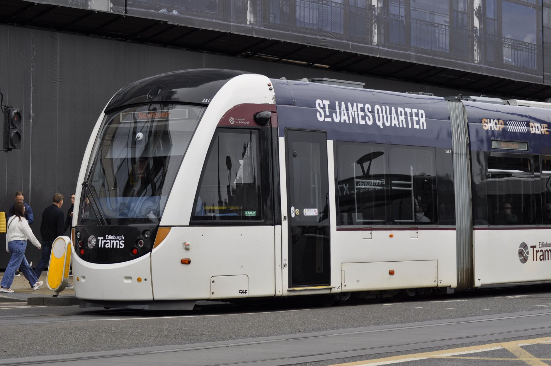 An Edinburgh tram in St James Quarter advertising livery