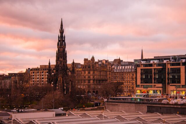 The Scott Monument and Princes Street frontage in Edinburgh at sunset