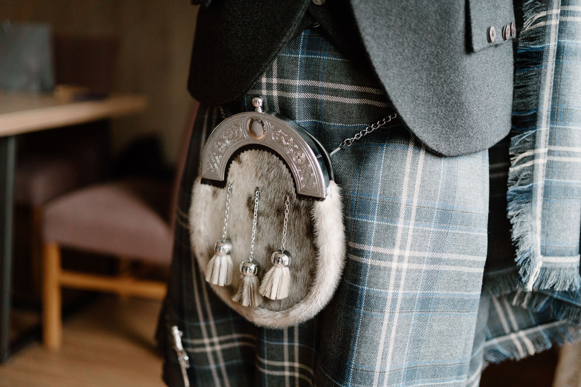 Close-up of a traditional Scottish kilt with a fur sporran and chain strap