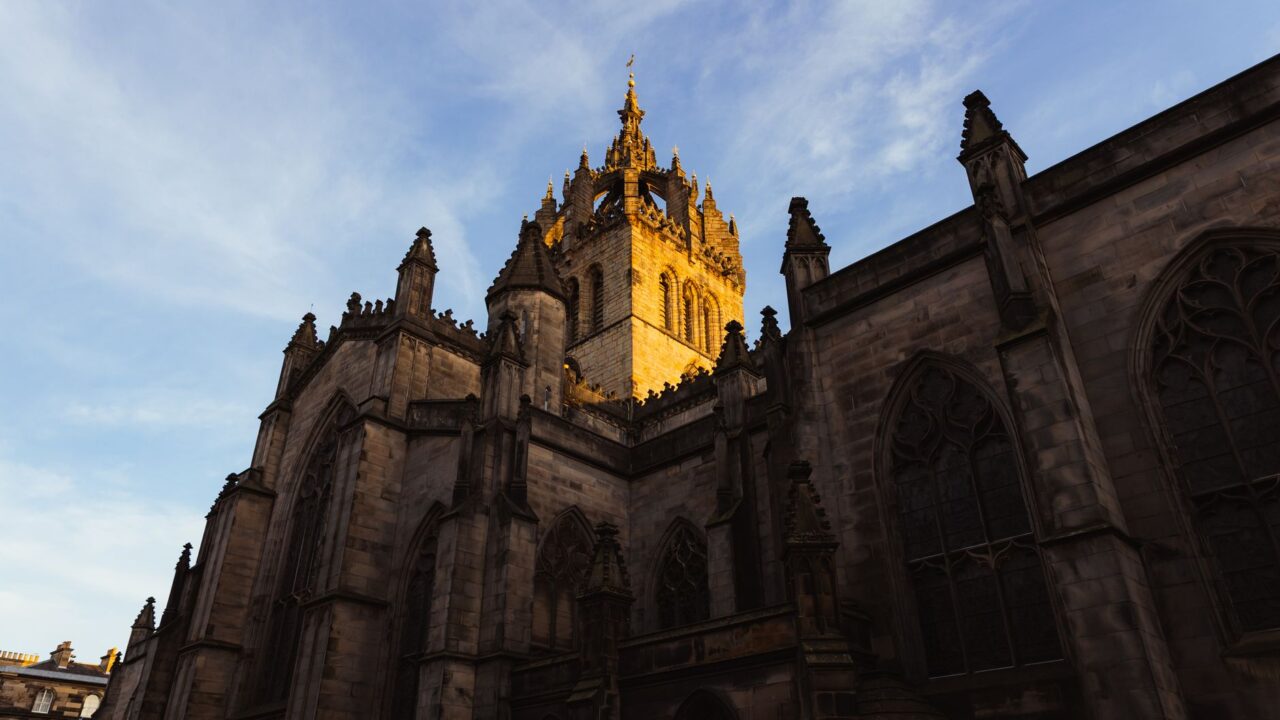 St Giles Cathedral in Edinburgh with its crown steeple lit by low sunset light
