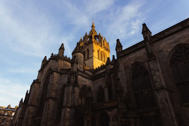 St Giles Cathedral in Edinburgh with its crown steeple lit by low sunset light