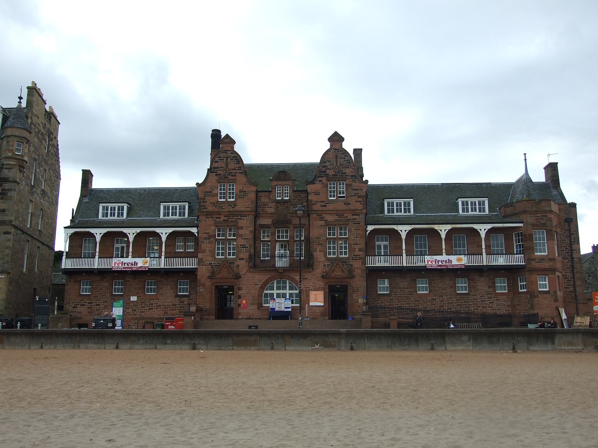 Portobello Swim Centre faces the sandy beach with red sandstone gables and long white balconies above the promenade.